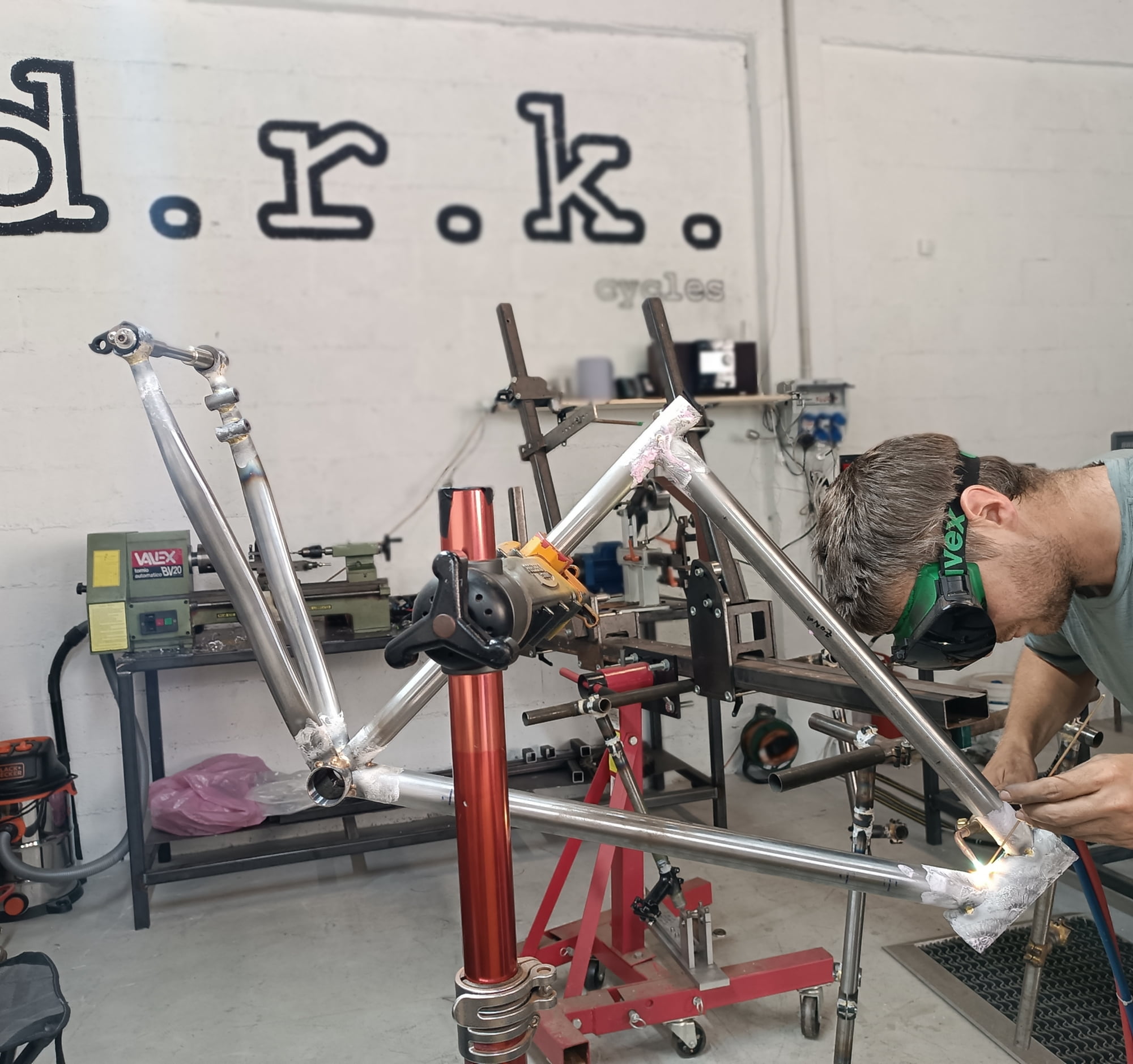 Daniel brazing a bicycle frame in his workshop