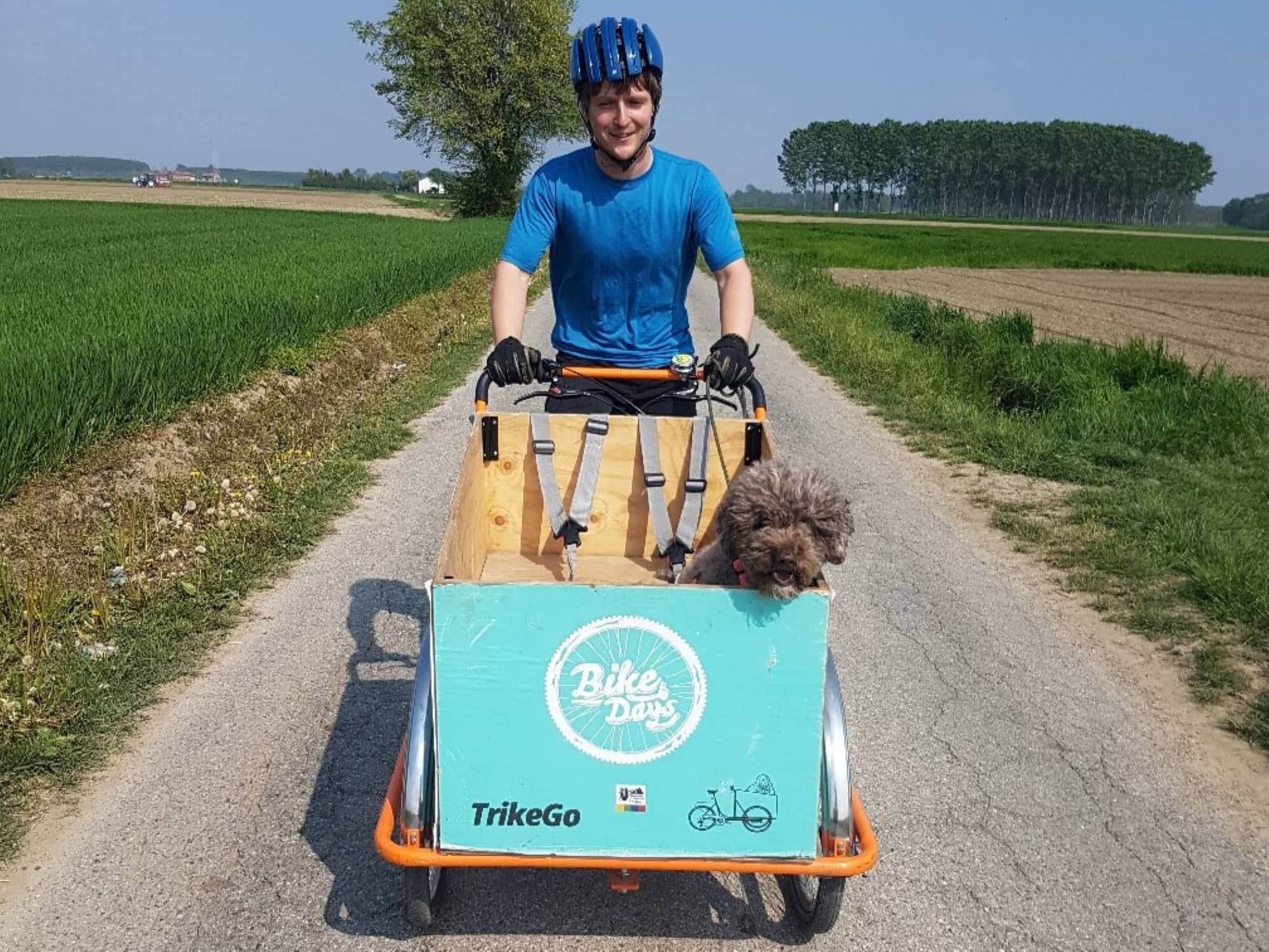 Daniel cyciling with Zola in a cargo trike